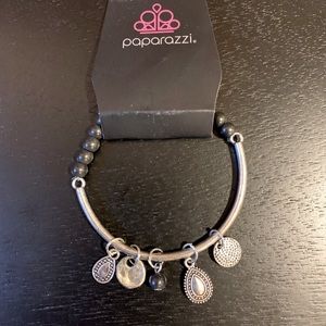 Silver and black bead bracelet with charms